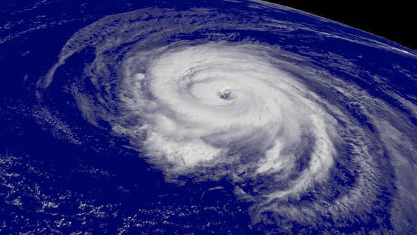 A satellite image shows Hurricane Helene spinning...