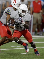 Arizona running back J.J. Taylor (23) during the first