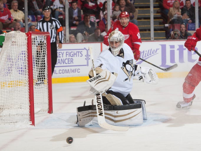 Penguins goalie Thomas Greiss makes a save in the first