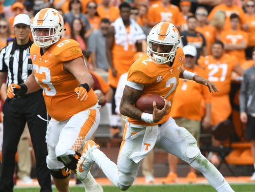 Tennessee quarterback Jarrett Guarantano (2) runs with