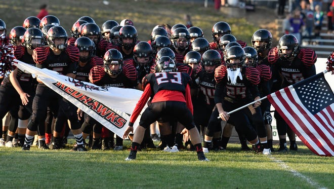The Marshall Redhawks prepare to take the field Thursday night to face off against Coldwater.