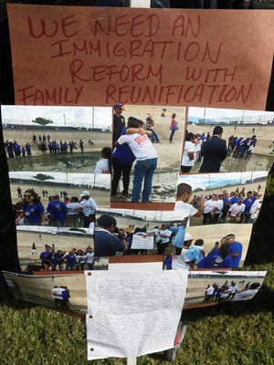 Photographs of a brief gathering of separated families was on display Monday. 