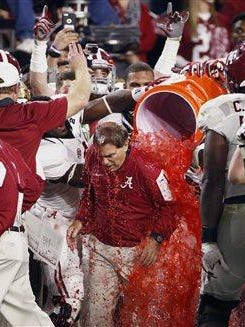 Alabama head coach Nick Saban gets doused after the Jan. 11 NCAA college football playoff championship game against Clemson in Glendale, Ariz. Alabama won 45-40.