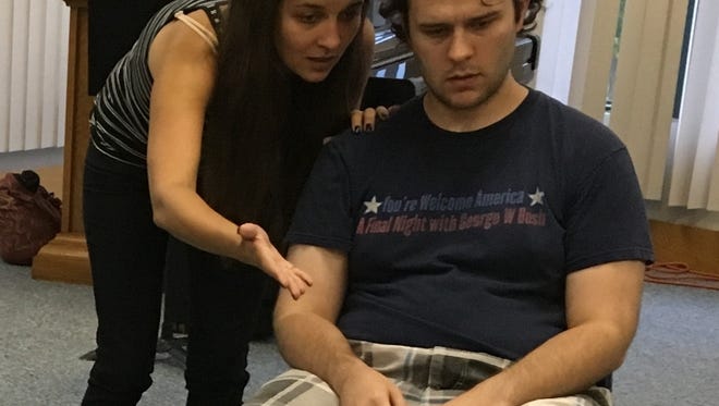 Leila Toba and Andrew Mertz, cast members of Louisville Repertory Company's production of "Smoke and Mirrors" in rehearsal.