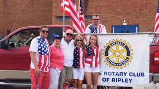Ripley Rotarians proudly display the Rotary Club of Ripley banner.
