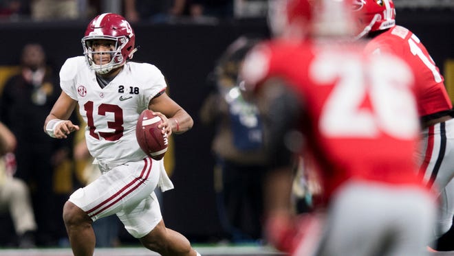 Alabama quarterback Tua Tagovailoa (13) looks to pass against Georgia in second half action of the College Football Playoff National Championship Game in the Mercedes Benz Stadium in Atlanta, Ga., on Monday January 8, 2018. (Mickey Welsh / Montgomery Advertiser)