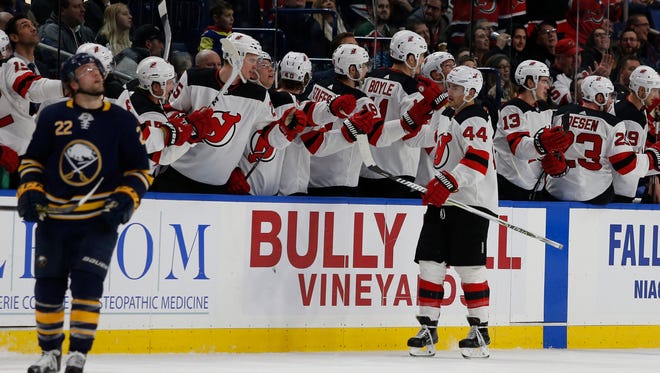 New Jersey Devils left wing Miles Wood (44) celebrates after scoring a goal during the second period against the Buffalo Sabres at KeyBank Center.