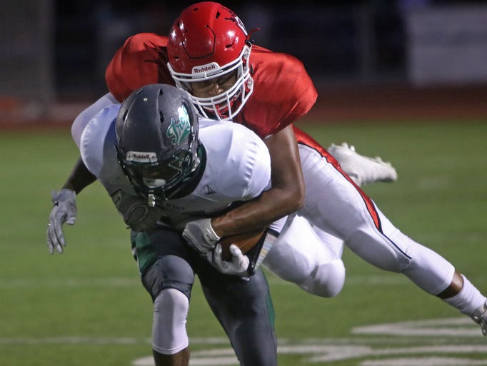 Wauwatosa East's Matthew Kubicek tackles Wauwatosa