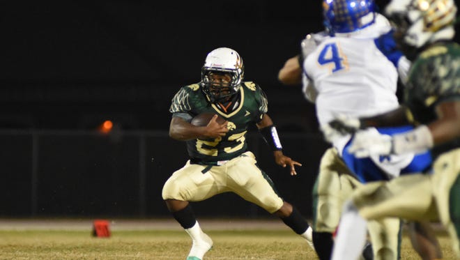 Viera High's Keith Freeman (23) runs for a first down after receiving a pass from Timothy DeMorat (12).