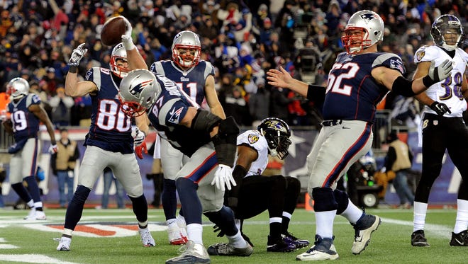 Rob Gronkowski #87 of the New England Patriots celebrates after scoring a touchdown in the third quarter against the Baltimore Ravens during the 2015 AFC Divisional Playoffs game at Gillette Stadium on January 10, 2015 in Foxboro, Massachusetts.