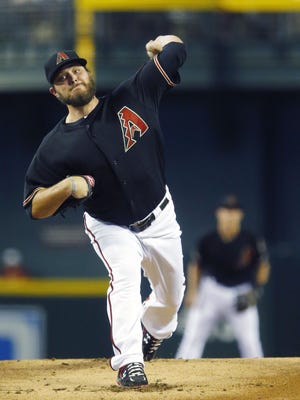 Arizona Diamondbacks starting pitcher Wade Miley (36) threw 99 pitches and 64 strikes in 7 innings against the  Chicago Cubs in their MLB game Saturday, July 19, 2014 in Phoenix.