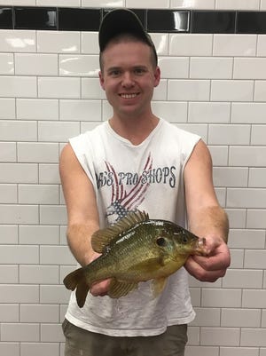 James Lucas broke the state record by catching a 1-pound, 1-ounce redear sunfish with a throwline.