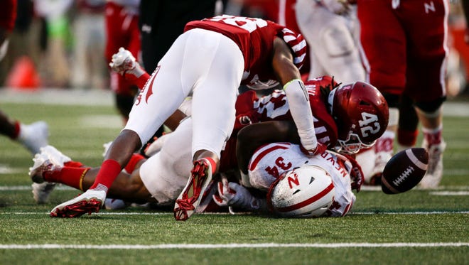 The ball appears fumbled by Nebraska Cornhuskers running back Terrell Newby (34) but the fumble was overturned after a review of the play late in the second half of the game at Memorial Stadium.