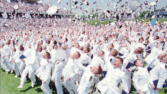 Members of the 1995 class at the U.S. Naval Academy toss their hats into the air at the conclusion of the graduation and commissioning ceremonies at the Navy-Marine Corps Stadium in Annapolis, Wednesday, May 31, 1995.