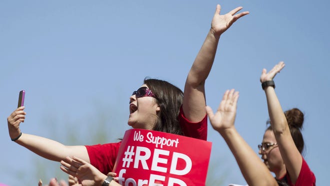 Mariana Tovar, an Arizona teacher, cheers during the RedforEd walkout at the state Capitol in Phoenix on May 3.