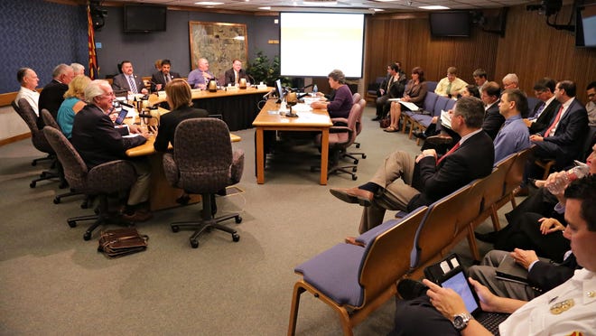 The Glendale City Council meets to hear facilitator Karen Kurtz (in purple) discuss an anti-discrimination ordinance in Glendale on May 19, 2015.