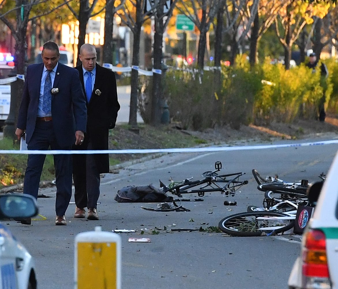 Police investigate the scene at a bike path in lower Manhattan after a motorist drove onto the path near the World Trade Center memorial, striking and killing several people on Oct. 31, 2017, in New York.