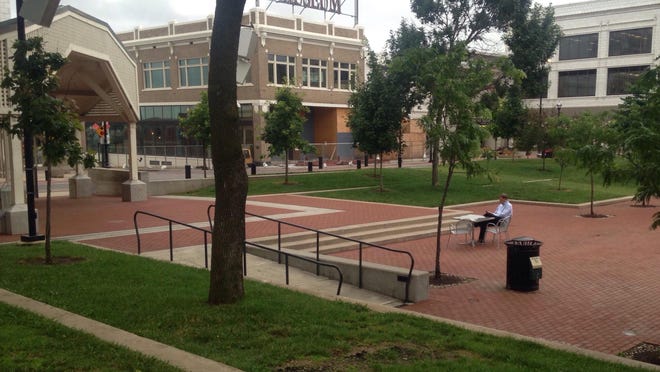 Rusty Worley, executive director of the Urban Districts Alliance, set up a table and two chairs on the downtown square at the request of the Answer Man.