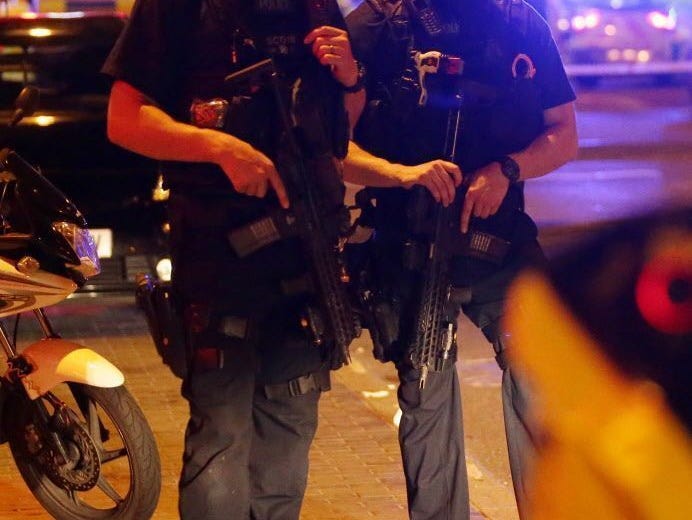 Police guard a street in the Finsbury Park area of north London where a vehicle hit pedestrians on June 19, 2017.