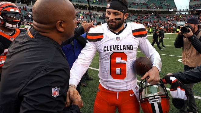 Nov 25, 2018; Cincinnati, OH, USA; Cincinnati Bengals special assistant to the head coach Hue Jackson (left) meets with Cleveland Browns quarterback Baker Mayfield (6) after their game at Paul Brown Stadium. Mandatory Credit: Aaron Doster-USA TODAY Sports