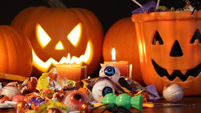 Closeup of candies with pumpkins after Hallowen festivities