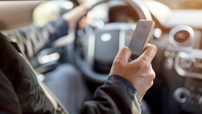 Using a phone in a car texting while driving is dangerous.