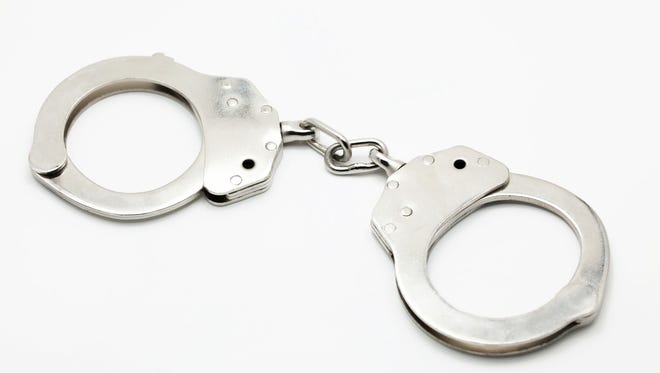 Closed Handcuffs on white isolated background.