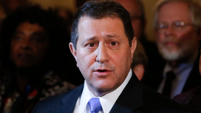 Assembly Majority Leader Joseph Morelle, D-Rochester, with Democratic members of the Assembly behind him, talks to reporters at the Capitol about the arrest of Assembly Speaker Sheldon Silver on Thursday, Jan. 22, 2015, in Albany, N.Y. Silver, who has been one of the most powerful men in Albany for more than two decades, was arrested Thursday on public corruption charges. (AP Photo/Mike Groll)