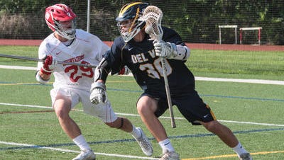 Delaware Valley's Joe Cansfield and Bernards' Dan Schindler battle for the ball during the South Group I semifinals on May 25, 2016.