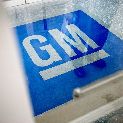 The GM logo at the entrance of a GM information te