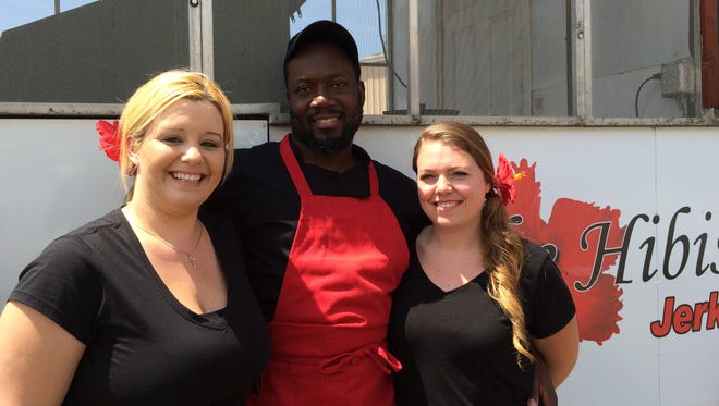 The Hibiscus Jerk Hut had its grand opening at 1107 N. Boonville Ave. on Monday. Co-owners Jamie Bumgarner and Gladstone Morrison, along with catering/sales manager Breann Hargrove, make up the team.