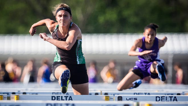 Yorktown's Hannah Rapp pulls ahead in the 100 meter hurdles during the girls track sectional at Delta High School Tuesday, May 15, 2018. 