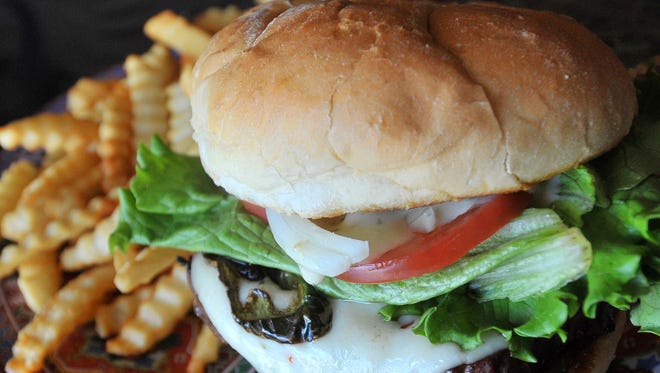 A jalapeno burger prepared Thursday at Third Avenue Cafe in Wausau.