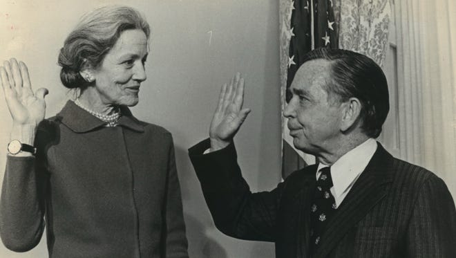 Margaret Chase Smith, who served as a Republican in both the U.S. Senate and House of Representatives, is shown being sworn in by Speaker of the House Carl Albert in this undated file photo.