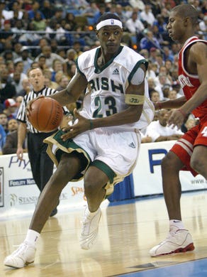 LeBron James drives the baseline on D.J. Strawberry