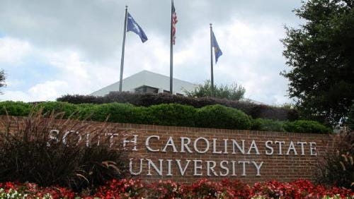 Flags fly at the entrance to South Carolina State University in Orangeburg, S.C.