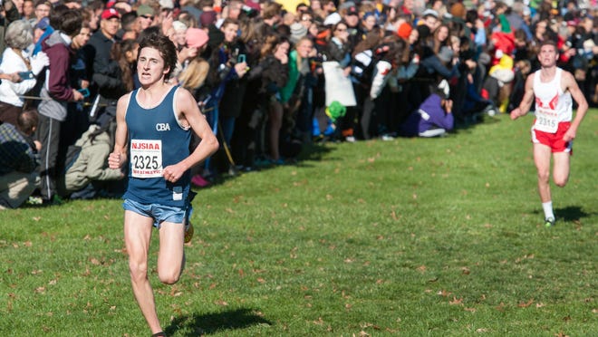 Finishing second in the boys race was CBA's Blaise Ferro (left). The Boys and Girls Cross-Country Meet of Champions event was held at Holmdel Park in Holmdel, NJ on Saturday, November 21, 2015. / Russ DeSantis/For The Asbury Park Press / Slug: ASB 1122 XC MOC