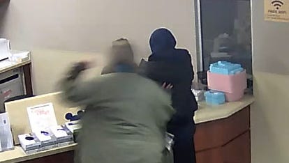 The footage shows the 19-year-old talking with an employee as a disheveled man walks briskly from behind then, without warning, starts pummeling the teen with his fist — striking her. The woman, wore a dark head covering identifying her as a Muslim.