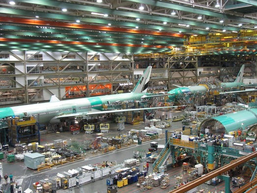 Boeing 777s move through Boeing's assembly line in