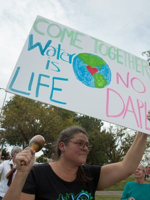 Laurie Shade-Neff,  along with more than 20 protesters, took to the corner of Main and Picacho, to protest the Dakota Access Pipeline, Tuesday, November 1, 2016. Shade- Neff has been protesting this pipeline, standing in front of the Federal building in Las Cruces for over eight weeks.