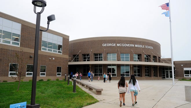 Students and their family attend the George McGovern Middle School open house in Sioux Falls, S.D., Thursday, Aug., 14, 2014.