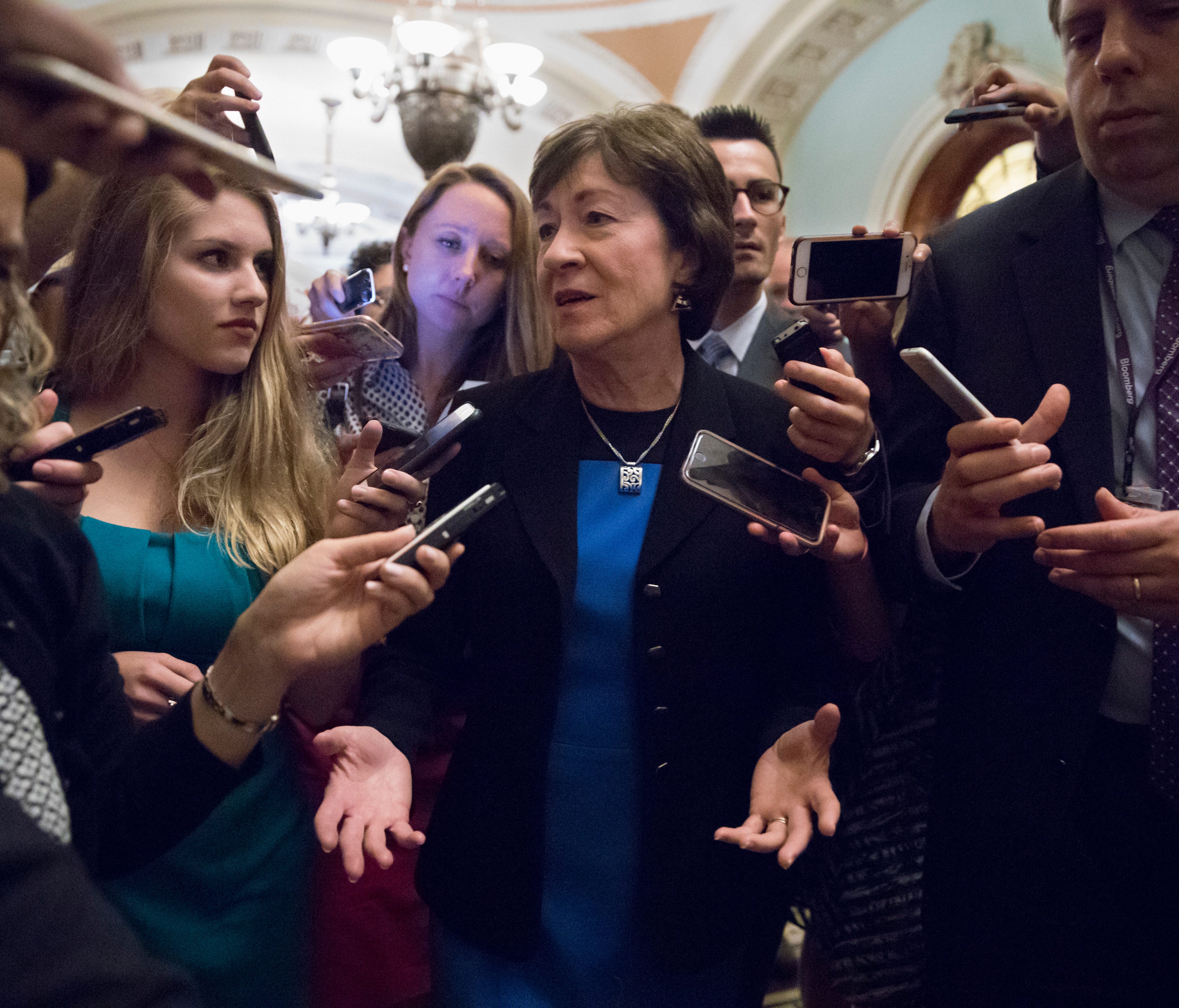 Sen. Susan Collins is surrounded by reporters on Capitol Hill on July 13, 2017.