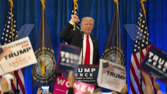 Donald Trump acknowledges supporters during a campaign rally in Atkinson, New Hampshire.