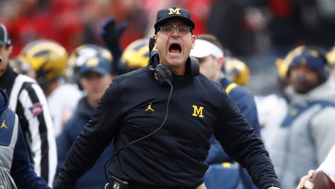 Michigan head coach Jim Harbaugh argues a call on the sideline during the first half against Ohio State at Ohio Stadium on Nov. 26, 2016.