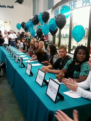 North Valleys students sign their letters of intent Friday at the school.