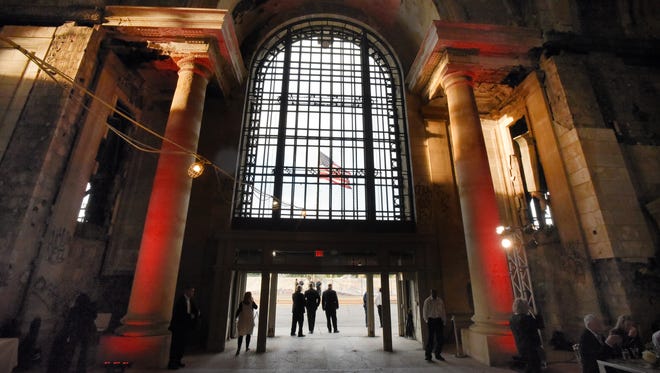The American flag is seen through the front entrance at the Michigan Central Depot in Detroit.