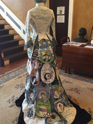 Panels on a dress being displayed at the AAUW of Rochester celebrate pioneering women.