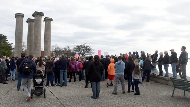 Participants attend a rally and inauguration day march at the Four Freedoms Monument in Evansville Friday.  The march concluded at the Evansville Vanderburgh Public Library's Central Library where a diversity fair was being held.