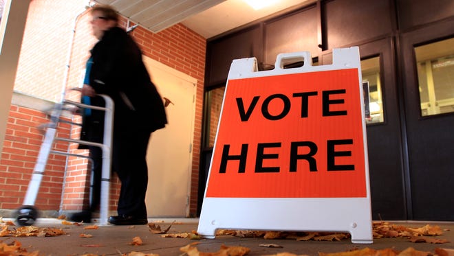 In this Gannett Wisconsin Media file photo a voter leaves the polling station at River View Middle School on November 4, 2014 in Kaukauna, Wisconsin.