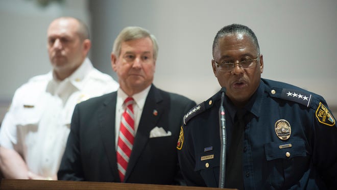 Police Chief Ernest Finley, right, who is pictured with Mayor Todd Strange, said recently that two-officer patrol units have been assigned to six "high-crime" districts in a pilot program that will likely be expanded.